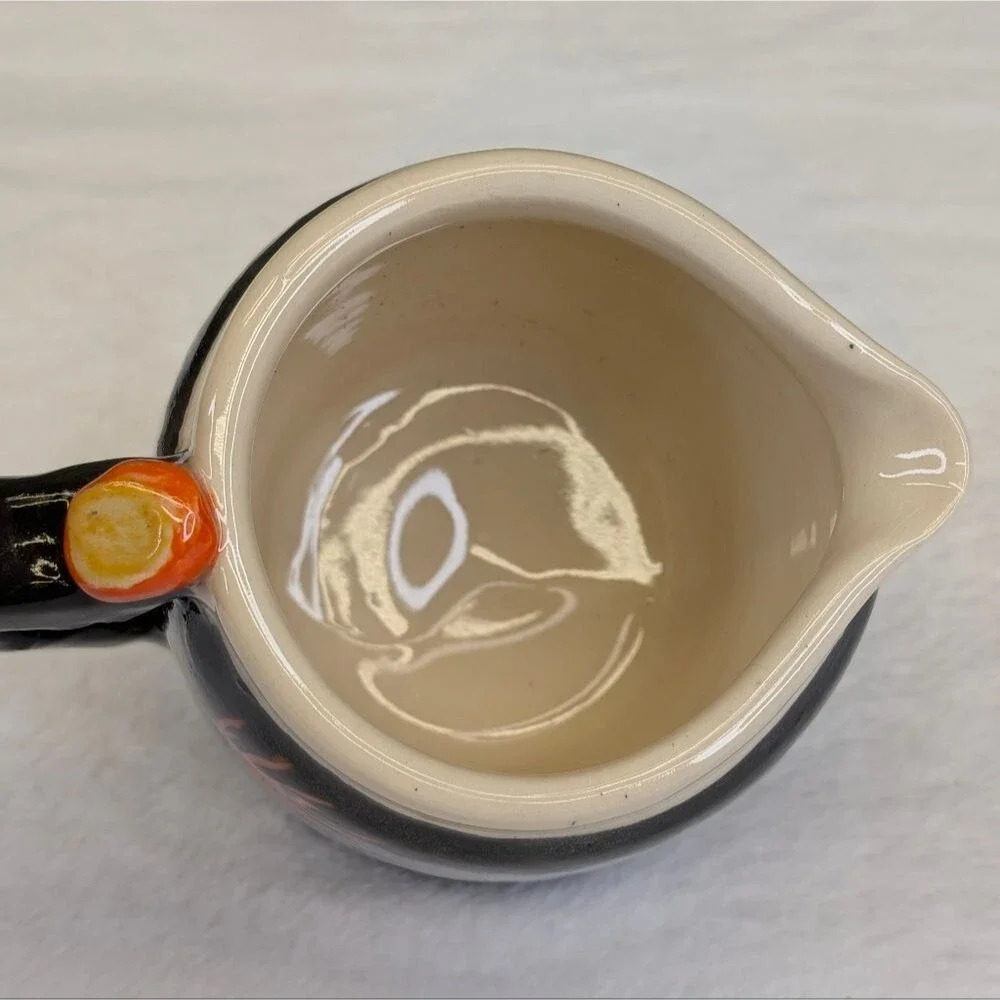 Handcrafted Black Ceramic Pitcher with Floral Design